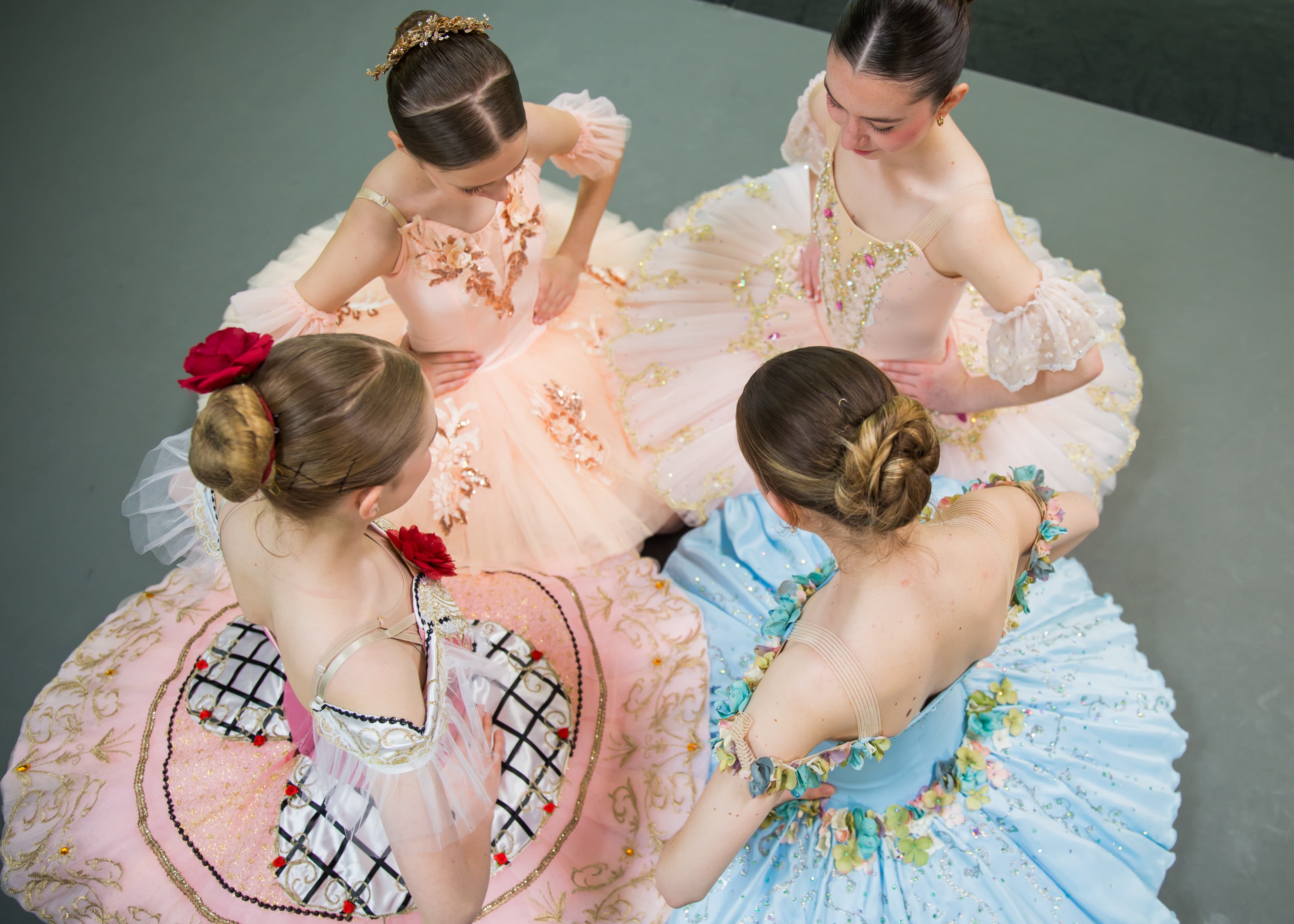 Young ballet dancers gathered backstage before a performance